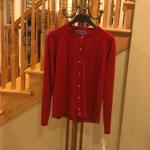 Red holiday sweater with pearl buttons